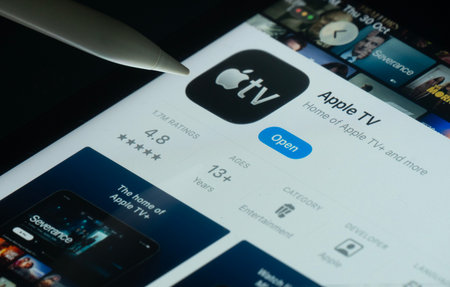 Dhaka, Bangladesh- 30 Oct 2025: Apple TV app on a iPad screen with a pen pointing at the install option.のeditorial素材