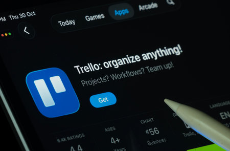 Dhaka, Bangladesh- 30 Oct 2025: Trello app displayed on a iPad screen in dark mode with a digital...