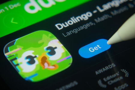 Dhaka, Bangladesh- 01 Dec 2025: A close-up of the Duolingo app icon in the App Store on an iPad screen.のeditorial素材