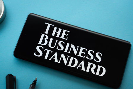 Dhaka, Bangladesh - 18 March 2025: The logo of The business standard is displayed on a smartphone screen.のeditorial素材