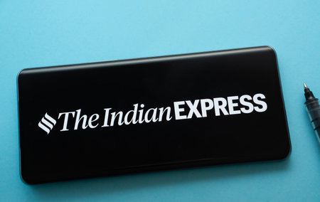 Dhaka, Bangladesh - 18 March 2025: The logo of The Indian Express is displayed on a smartphone screen.のeditorial素材