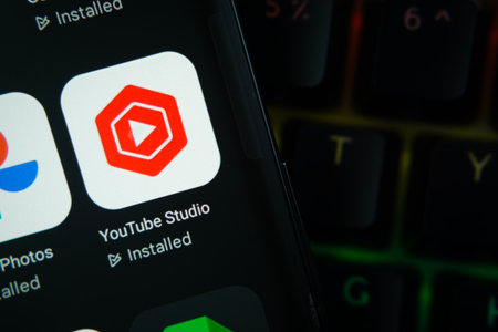 Dhaka, Bangladesh- 27 July 2025: Close-up of smartphone screen showing the youtube studio app icon with a dark interface.のeditorial素材
