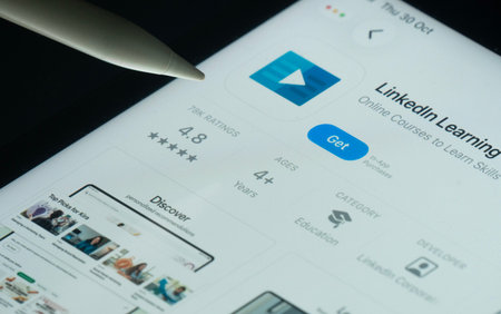 Dhaka, Bangladesh- 30 Oct 2025: Linkedin Learning app on a iPad screen with a pen pointing at the install option.のeditorial素材