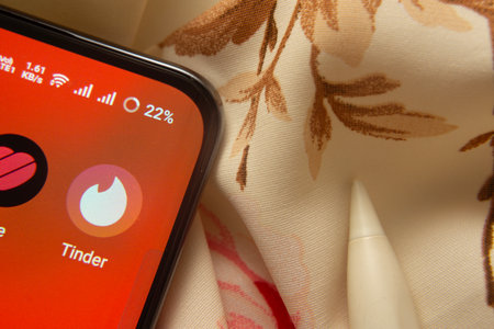 Dhaka, Bangladesh- 07 May 2025: Tinder app icon is seen on smartphone.のeditorial素材