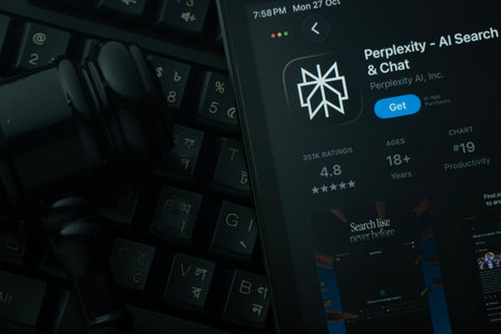 Dhaka, Bangladesh- 28 Oct 2025: An iPad displaying the Perplexity app against a judge's gavel and dark keyboard background.のeditorial素材