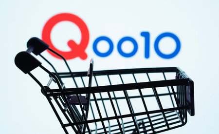 Dhaka, Bangladesh- 03 July 2025: Silhouette of a shopping cart in front of the Qoo10 logo, symbolizing ecommerce and online shoppingのeditorial素材