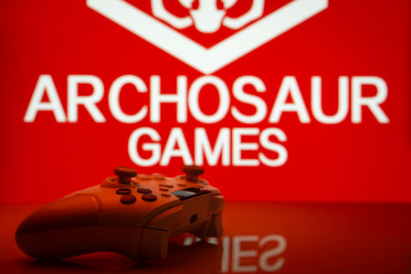 Dhaka, Bangladesh- 20 Mar 2025: A close-up of a white gamepad with the Archosaur Games seen on...