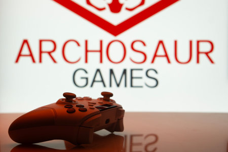 Dhaka, Bangladesh- 20 Mar 2025: A close-up of a white gamepad with the Archosaur Games seen on...