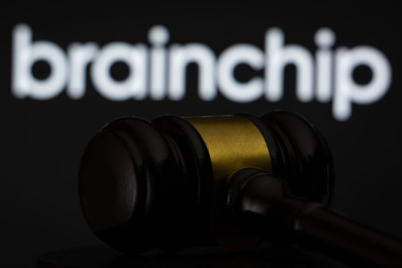 Dhaka, Bangladesh - 12 May 2026: A wooden judge's gavel is seen in front of the BrainChip logo displayed on a screen.