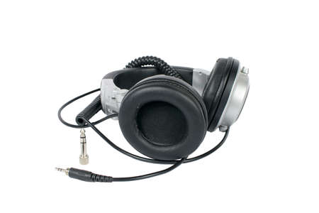 A close-up shot of worn-out, used studio headphones (studio monitors).の写真素材