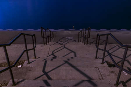 A shot of stairs going downwards into Lake Michigan by Adler Planetarium in Chicago, Illinois.の写真素材