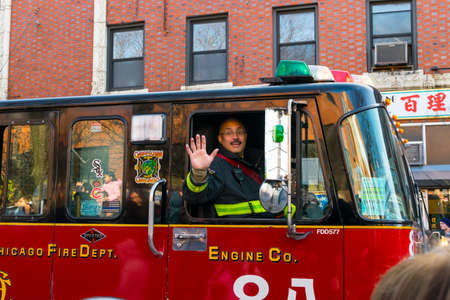 Chicago, IL, United States - February 5, 2017: Chicago's firifighter waves to people during Chinese...