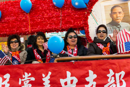 Chicago, IL, United States - February 5, 2017: Older Asian women participate in Chinese New Year parade in Chinatown.のeditorial素材