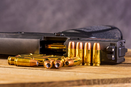 Ammunition loaded in the chamber of a handgun pistol.