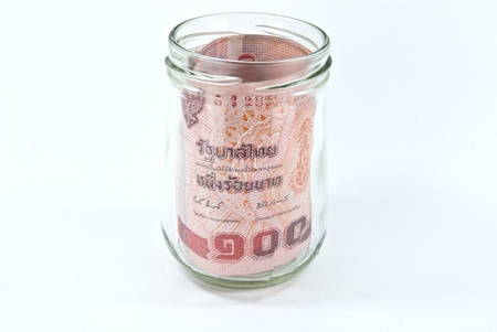 Money in the glass jar -- life savings in a bank.