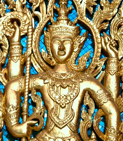 Traditional thai style art at buddhist temple door.の写真素材