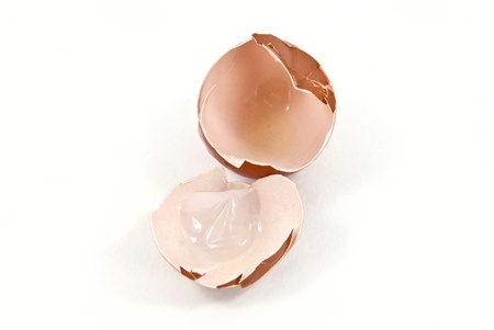 Broken egg shell shot on white background.の写真素材