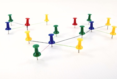 Push pins interconnected for network concept.