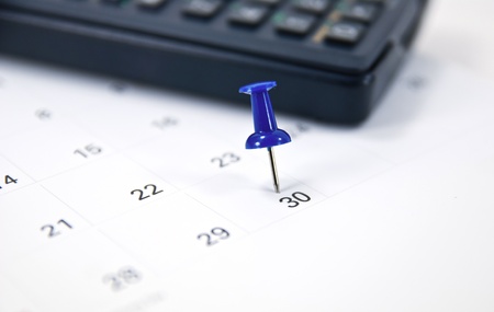 Blue Thumb Tack on Calendar.の写真素材