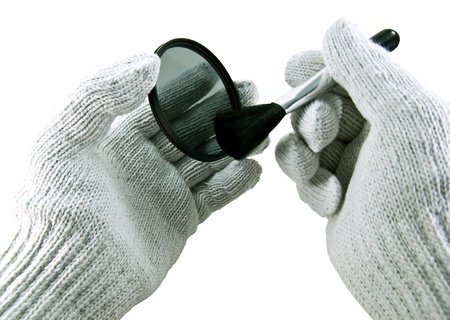 Hand cleaning camera lens protector.の写真素材