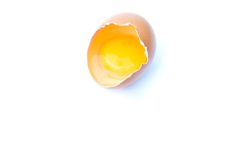 Egg smashed against a white background 