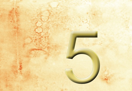 Golden number 5 on grungy background