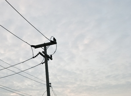 Electricity post with sky 