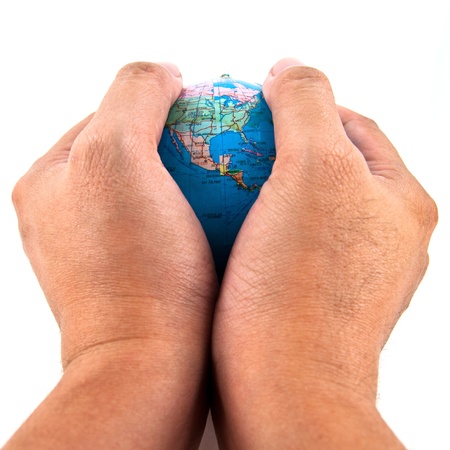 Hand holding the globe