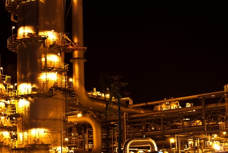 Petrochemical oil refinery plant at nightの写真素材