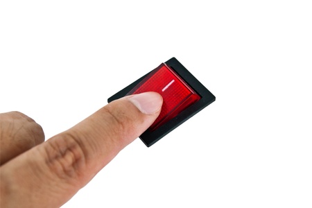 Hand turning off electrical switch 
