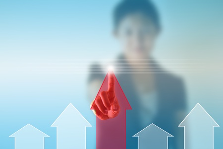 Business woman pressing chart の写真素材