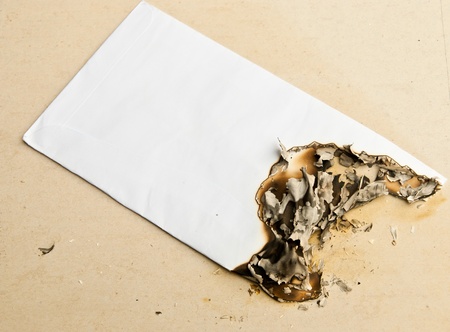 Burned white envelopeの写真素材