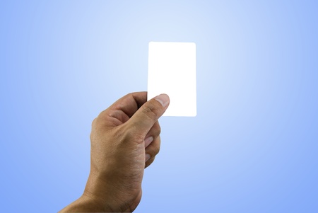 Hand holding white empty name card with clipping pathの写真素材