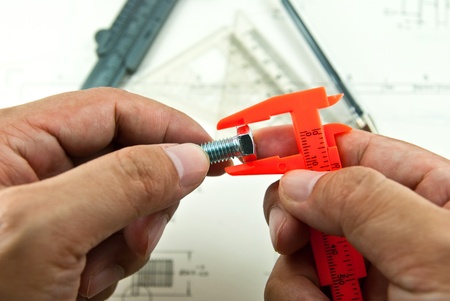 Technical drawing and tools in hand 