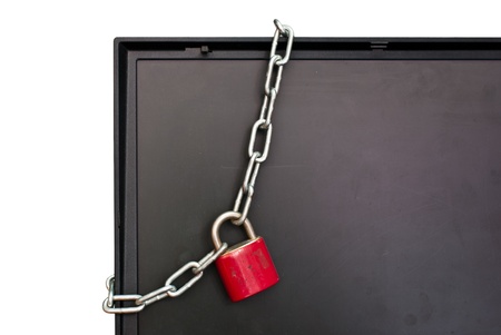 Laptop with padlock and chain の写真素材
