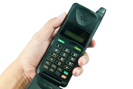 Very old mobile phone in a handの写真素材