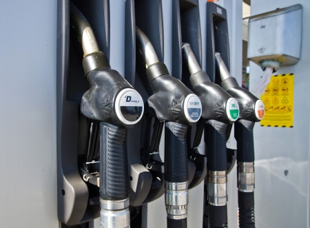 Gas pump nozzles in gas station のeditorial素材