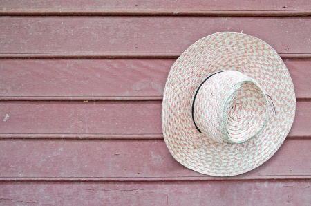 Old hat on a wooden wall の写真素材