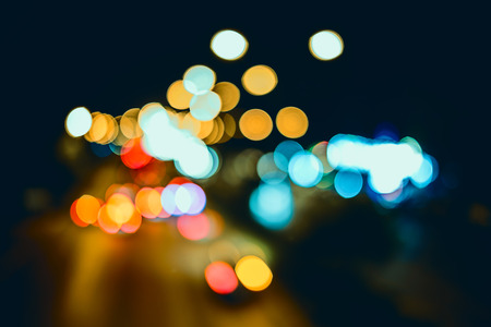 Abstract background, bokeh light on the traffic road at nightの写真素材