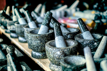 Selective focus of granite stone mortar and pestle, the famous Thai kitchenware product at Ang Sila, Chonburi, Thailandの写真素材