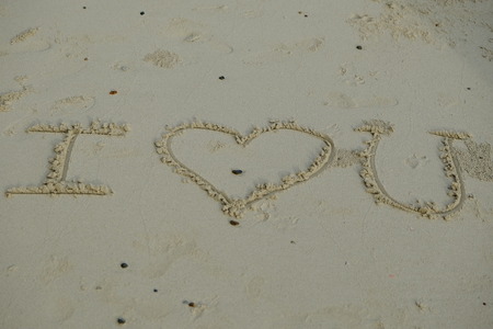 Word "I Love You" on sandy beachの写真素材