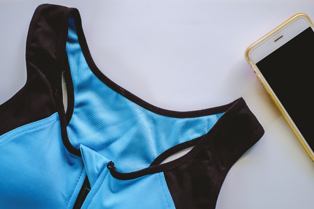 Sport bra for exercise with smartphone on white backgroundの写真素材