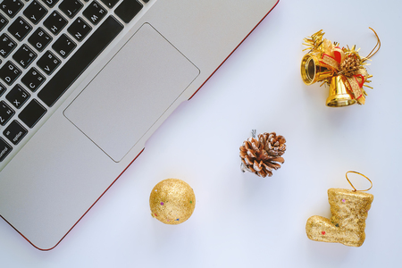 Computer Laptop for working with Christmas and New Year ornaments and decoration on white backgroundの写真素材