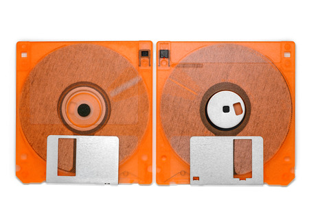 Front and back of floppy disk on white background, old technology and legacy industrial computer equipmentの写真素材