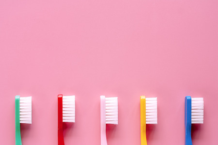 Toothbrush used for cleaning the teeth on pink background for dental care conceptの写真素材