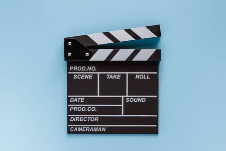 Movie clapper board on blue background for filming equipmentの写真素材