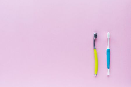 Set of toothbrush on pink background for dental care conceptの写真素材