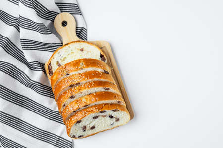 Vegan sliced fine whole wheat bread on white background for bakery, food and eating concept
