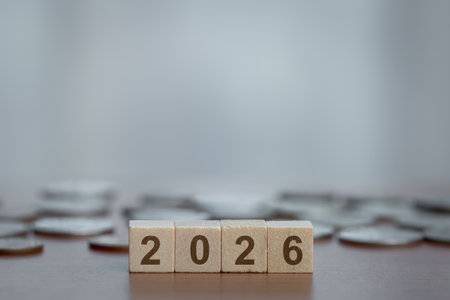 2026 wooden blocks with coins. Concept of financial planning, saving money, investment, future...