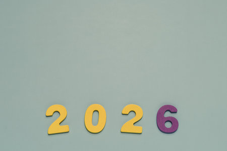 Prominent yellow and purple 2026 on a smooth pastel blue. Perfect for New Year, future planning,...